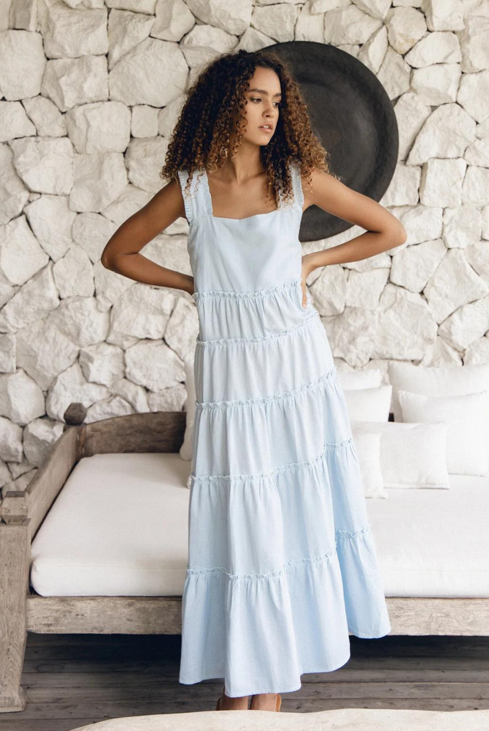 Model wearing the pale blue emery maxi dress with thick straps and tiered a line maxi skirt