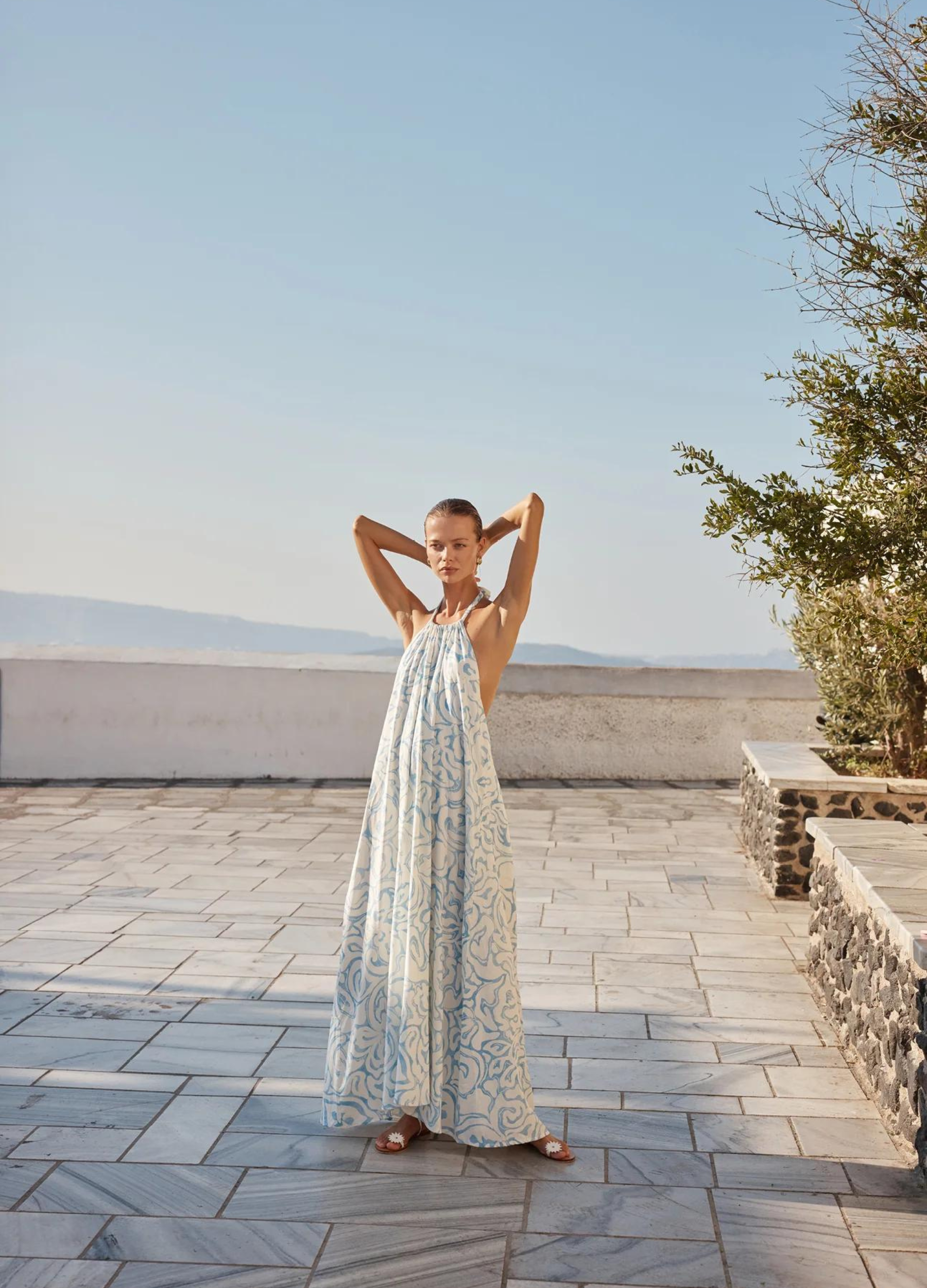 Model wearing the blue and white tamra maxi dress