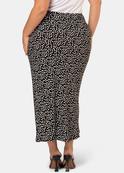 Model wearing the black and white spot print midi skirt in viscose crepe