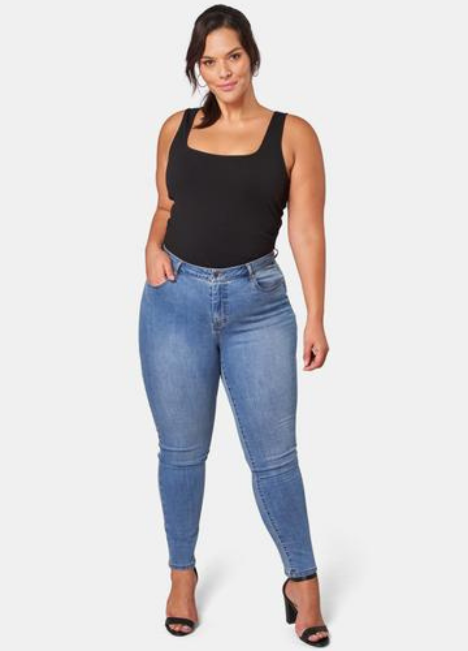 Model wearing the Kylie Skinny  Jean in Mid Wash