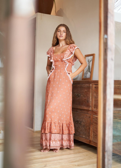 Terracotta colour printed maxi dress with double frill hem and back tie with ruffle shoulders
