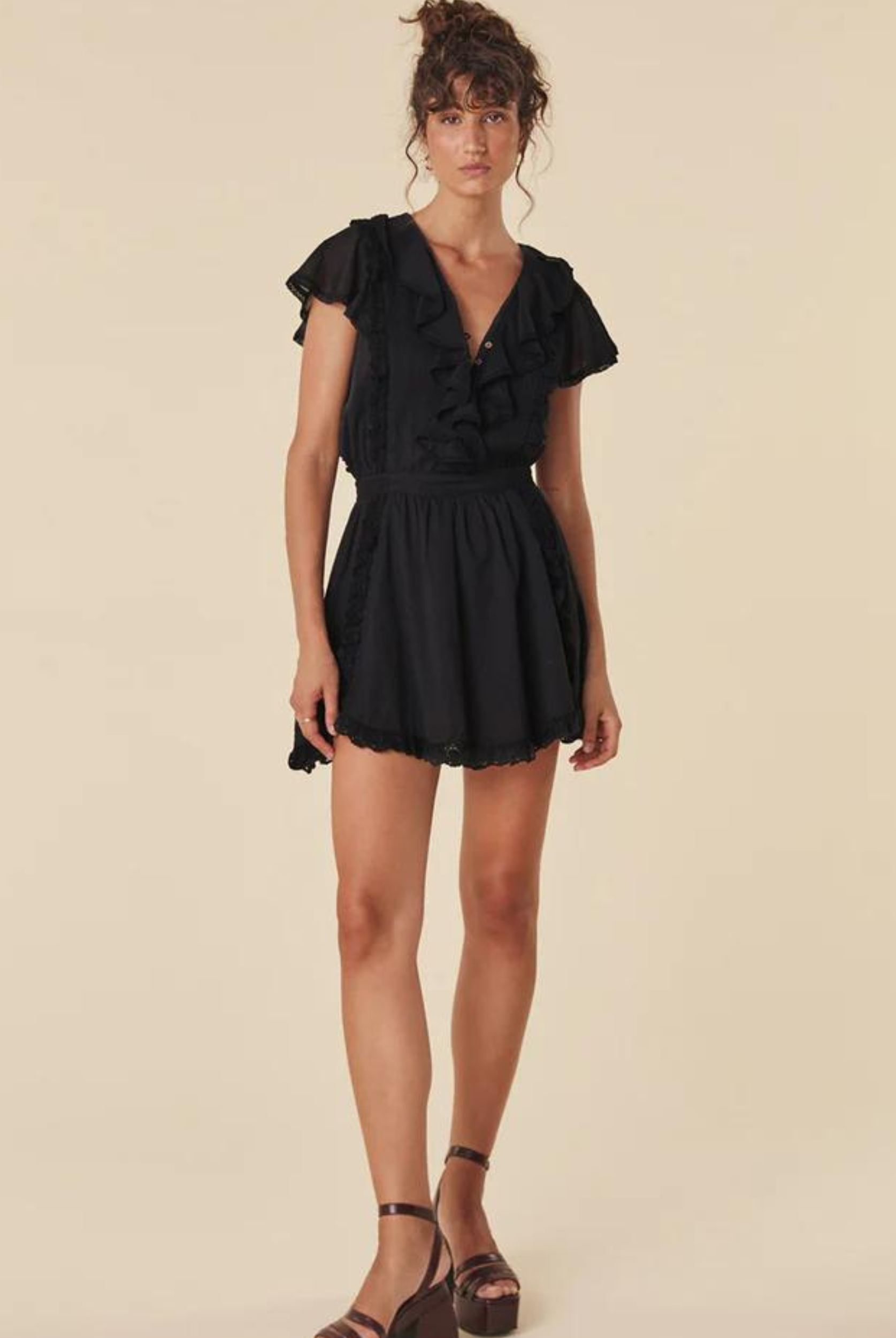 Model wearing the black dove lace mini dress