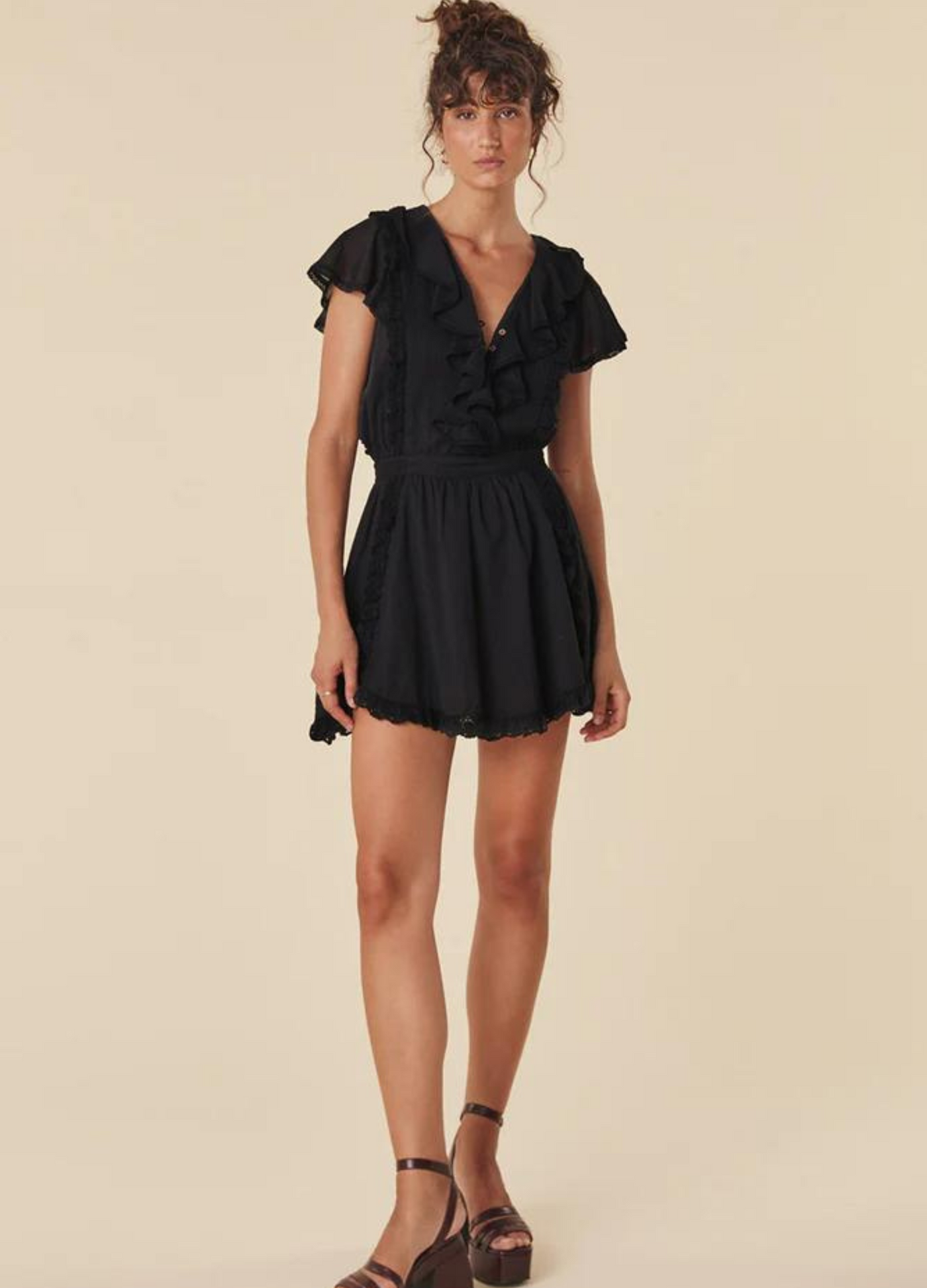 Model wearing the black dove lace mini dress