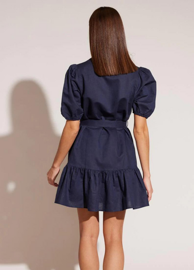 Woman wearing the Isola shirt dress in Navy Blue