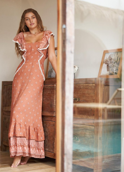 Terracotta colour printed maxi dress with double frill hem and back tie with ruffle shoulders