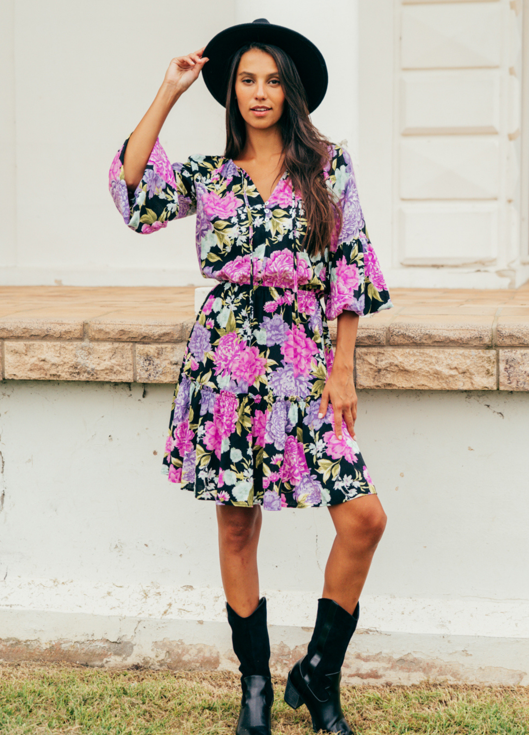 Model wearing the tarni mini dress in floral print