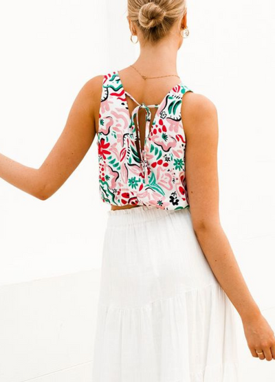 Model wearing a tiered off white maxi skirt with elasticated waistband