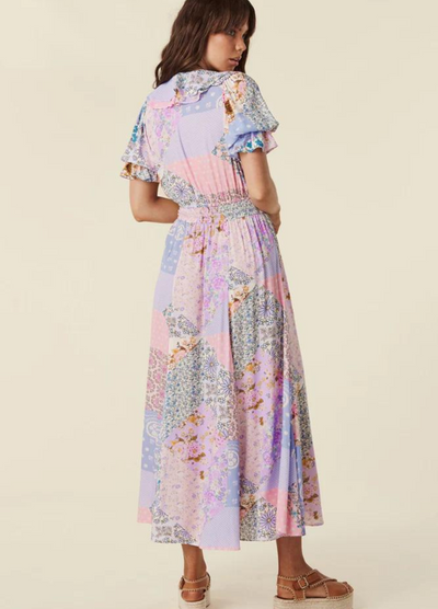 Model wearing the pastel print jacaranda gown from Spell (cha cha collection) 