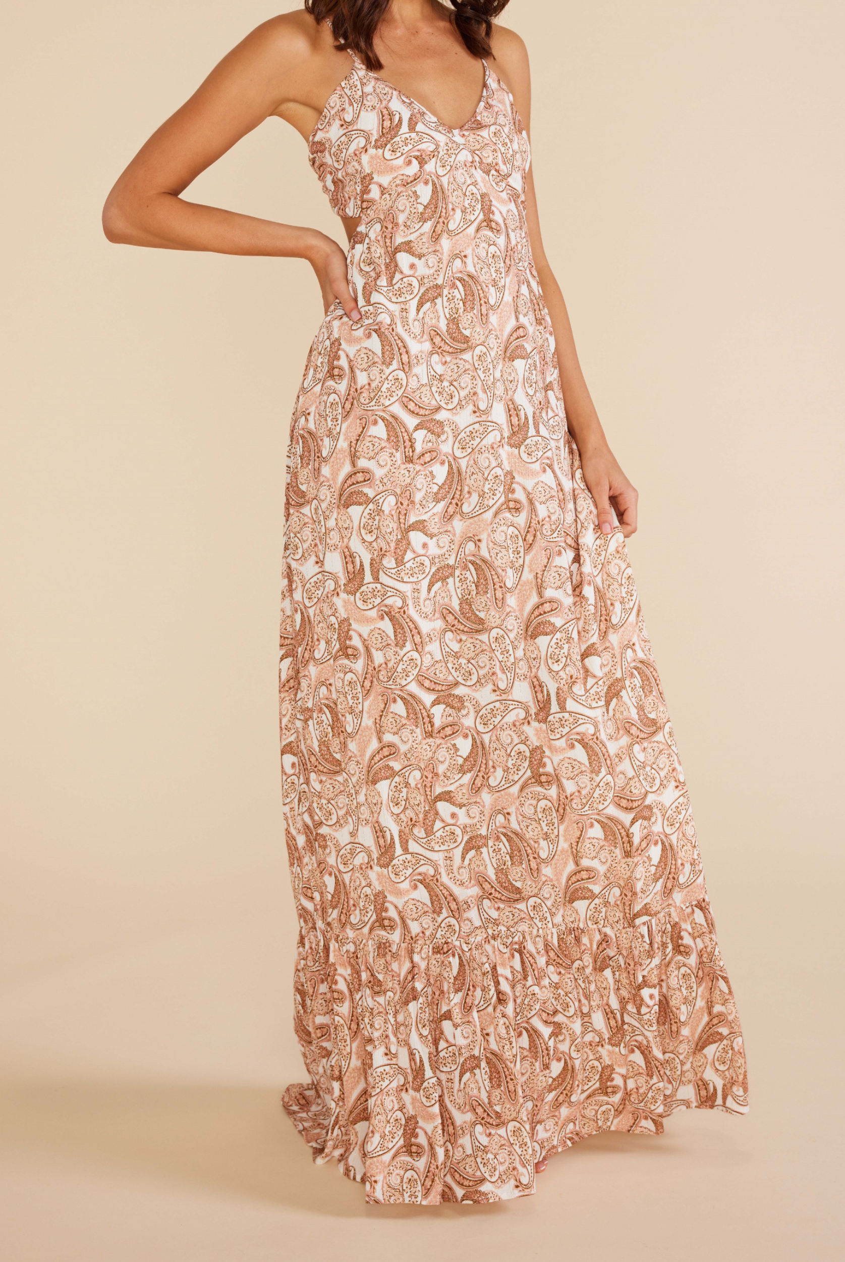 Model wearing the Neveah maxi dress in paisley print with tie back and adjustable straps