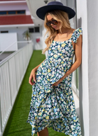 Model wearing the Pia Ditzy floral midi dress from Barefoot Blonde