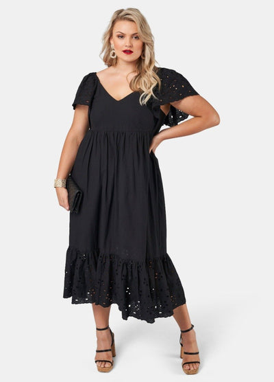 Blonde model wearing black cotton midi dress