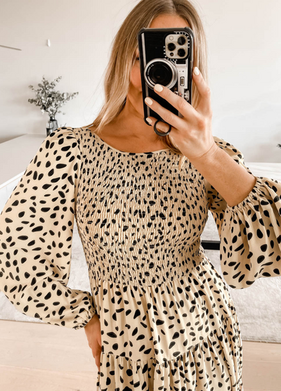 Girl taking a selfie of the spotty heather print midi dress