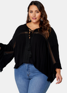 Woman wearing black boho blouse