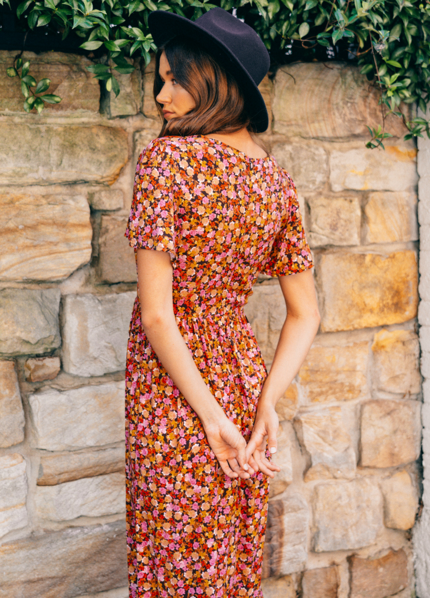 Brunette Model wearing floral midi dress