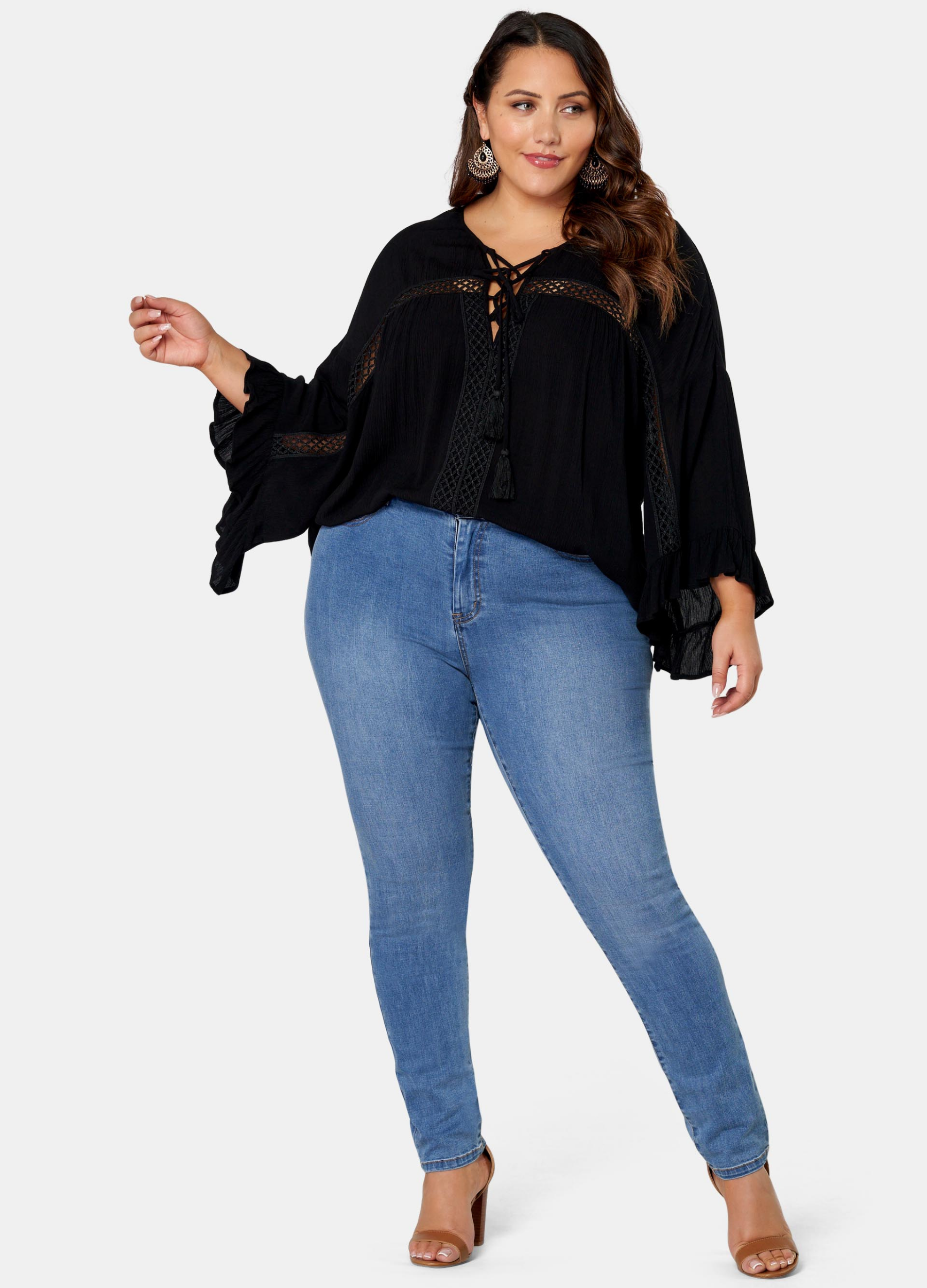 Woman wearing black boho blouse