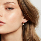 Aaliya earring in the ear of model with another sleeper to show how to wear