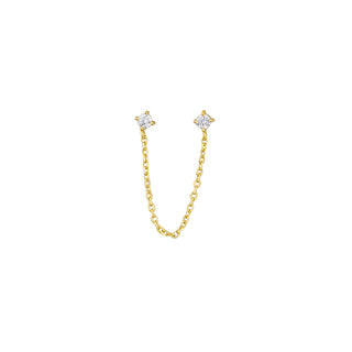 Girl wearing gold chain earring with cubic zirconia crystal