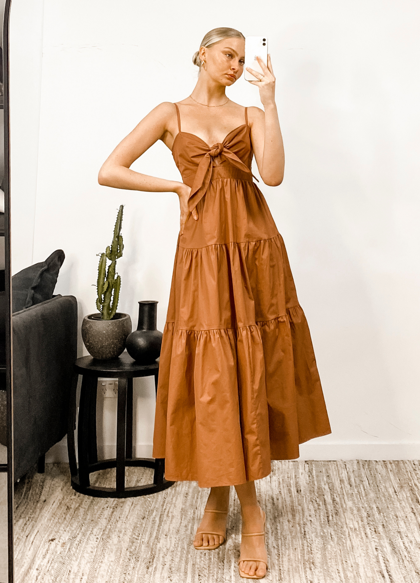 Blonde model wearing dress agatha a 100% cotton strappy dress with tie at bust