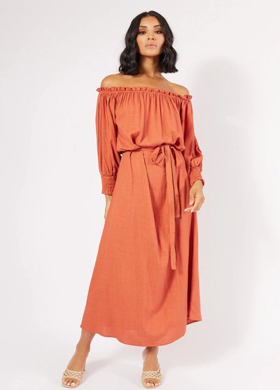 Model wearing the August Orange Maxi Dress from Girl and the Sun
