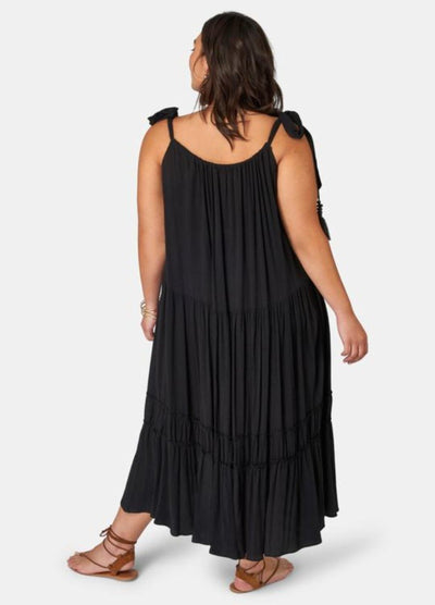 Brunette model wearing black maxi dress