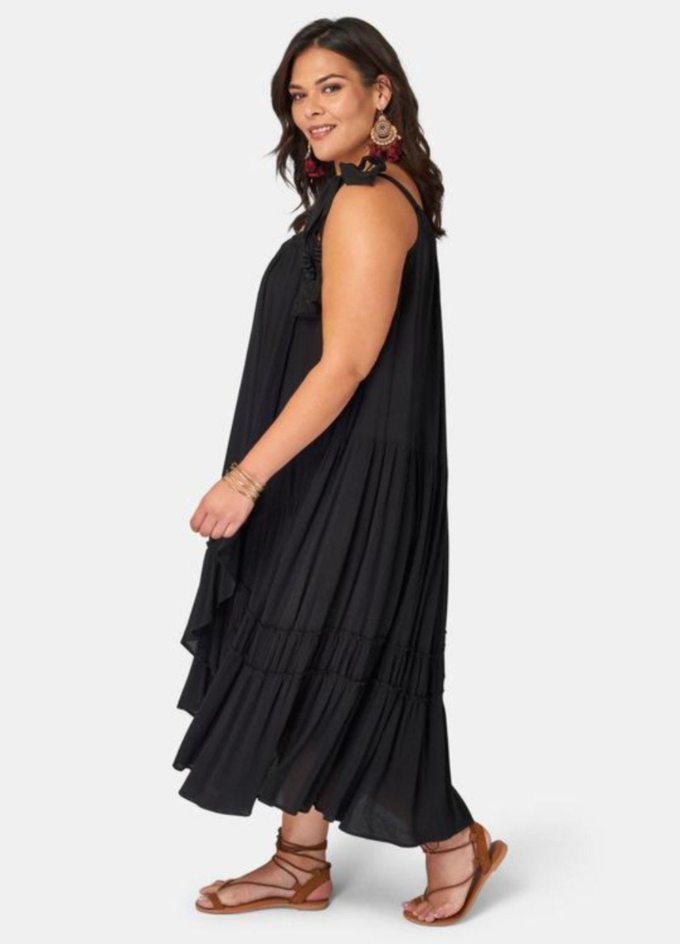 Brunette model wearing black maxi dress