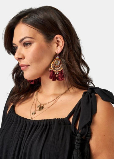 Brunette model wearing black maxi dress