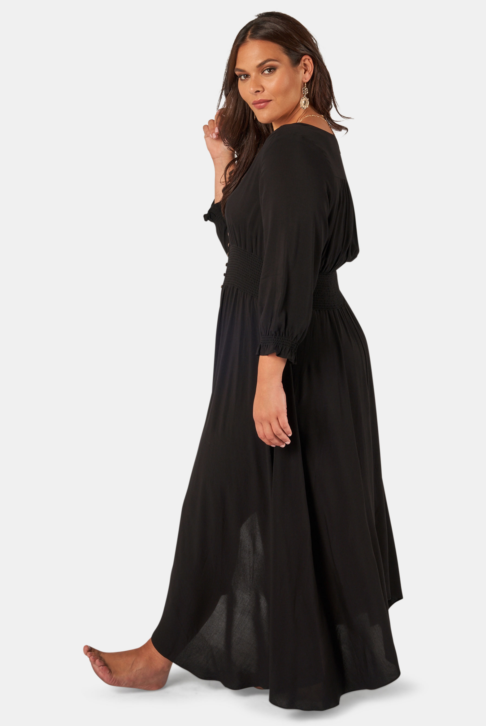 Model wearing the button through brown sugar dress in black