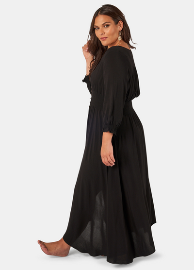 Model wearing the button through brown sugar dress in black