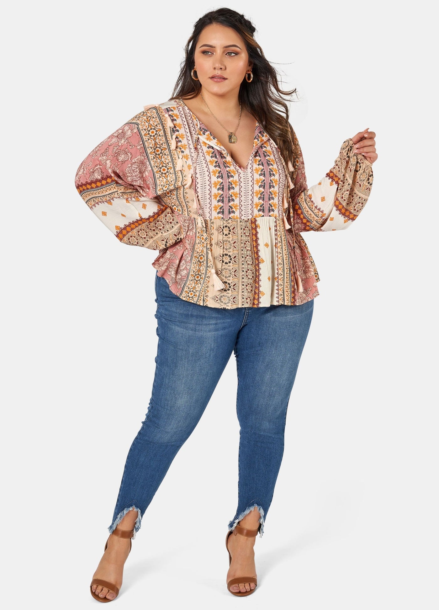 Woman wearing printed boho blouse with jeans