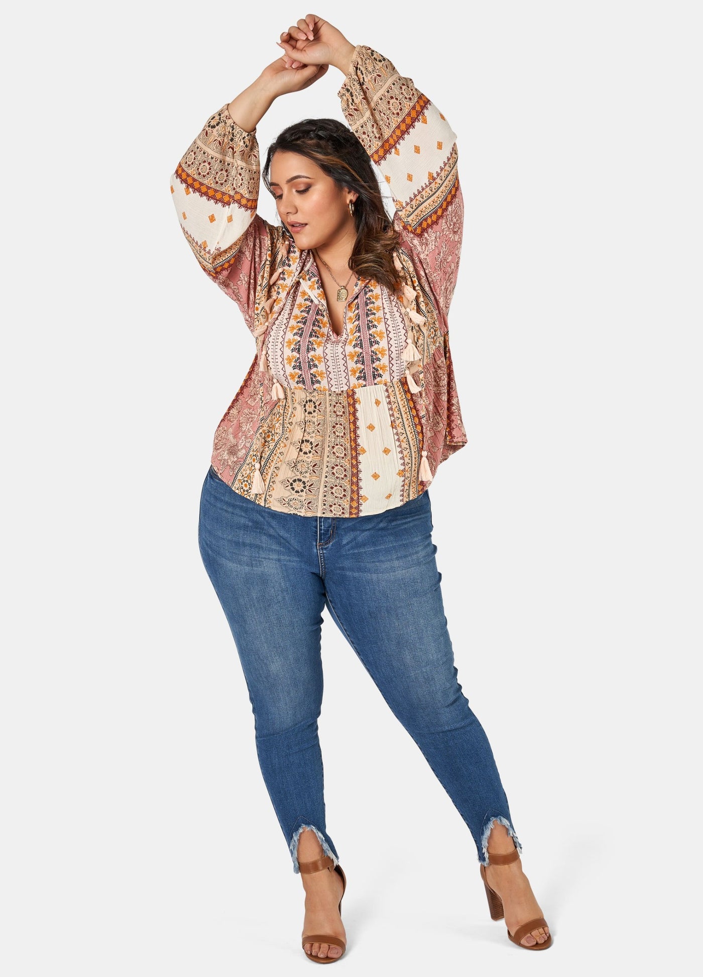 Woman wearing printed boho blouse with jeans