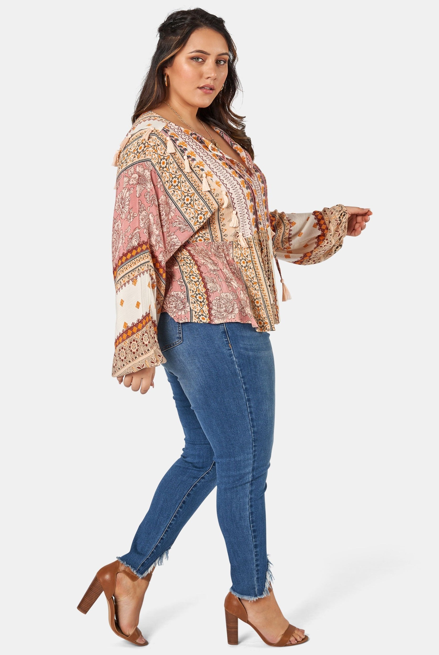 Woman wearing printed boho blouse with jeans