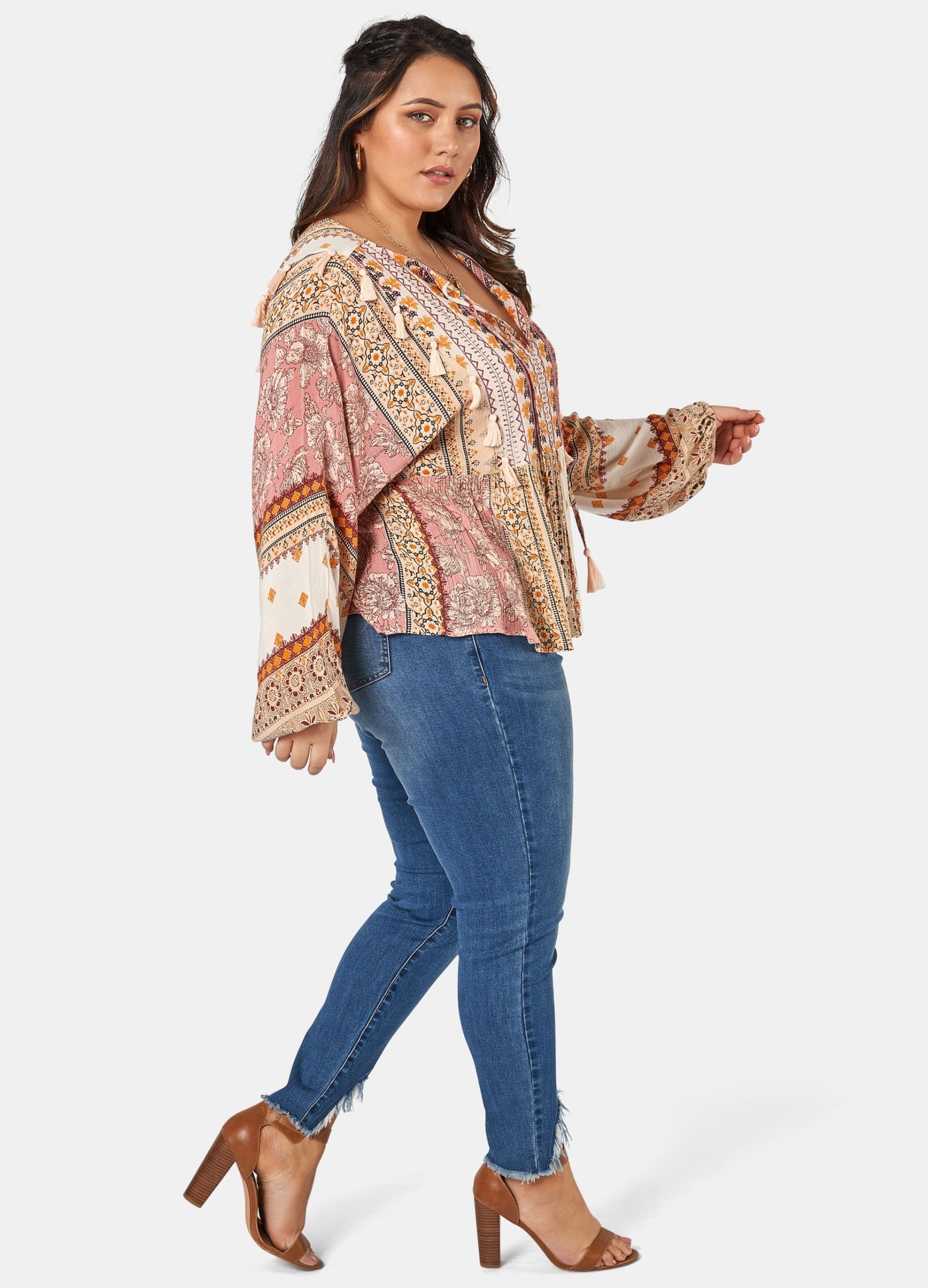 Woman wearing printed boho blouse with jeans