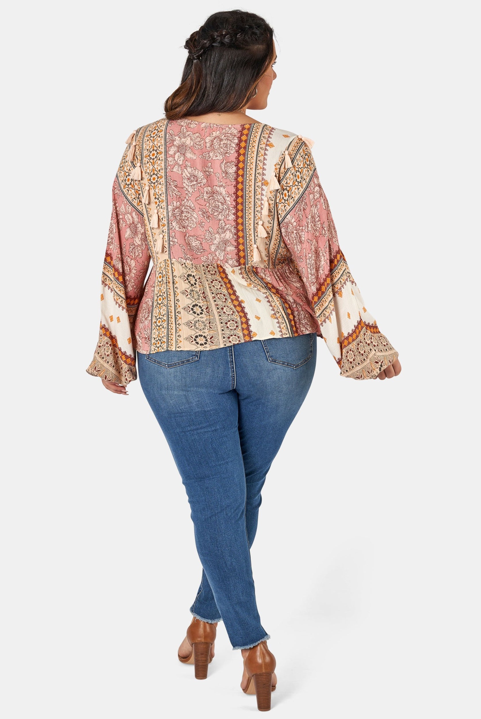 Woman wearing printed boho blouse with jeans