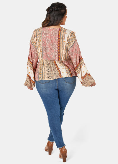 Woman wearing printed boho blouse with jeans