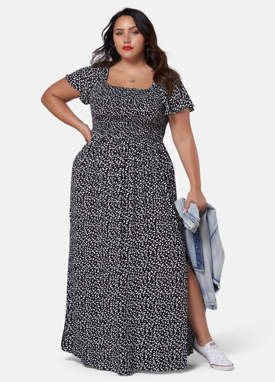 Woman wearing black and white print maxi dress
