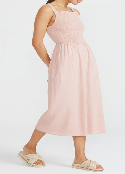 Model wearing strappy shirred sundress from Staple the Label