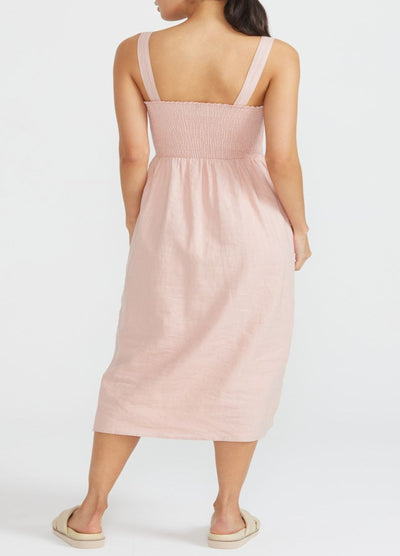 Model wearing the strappy midi dress from staple the label
