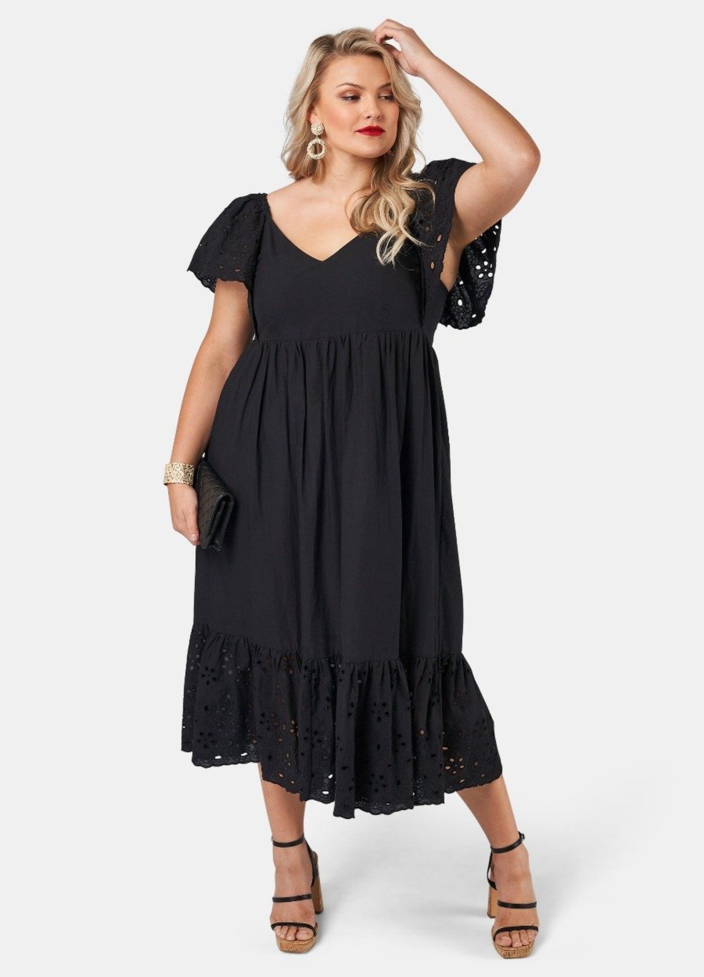 Blonde model wearing black cotton midi dress