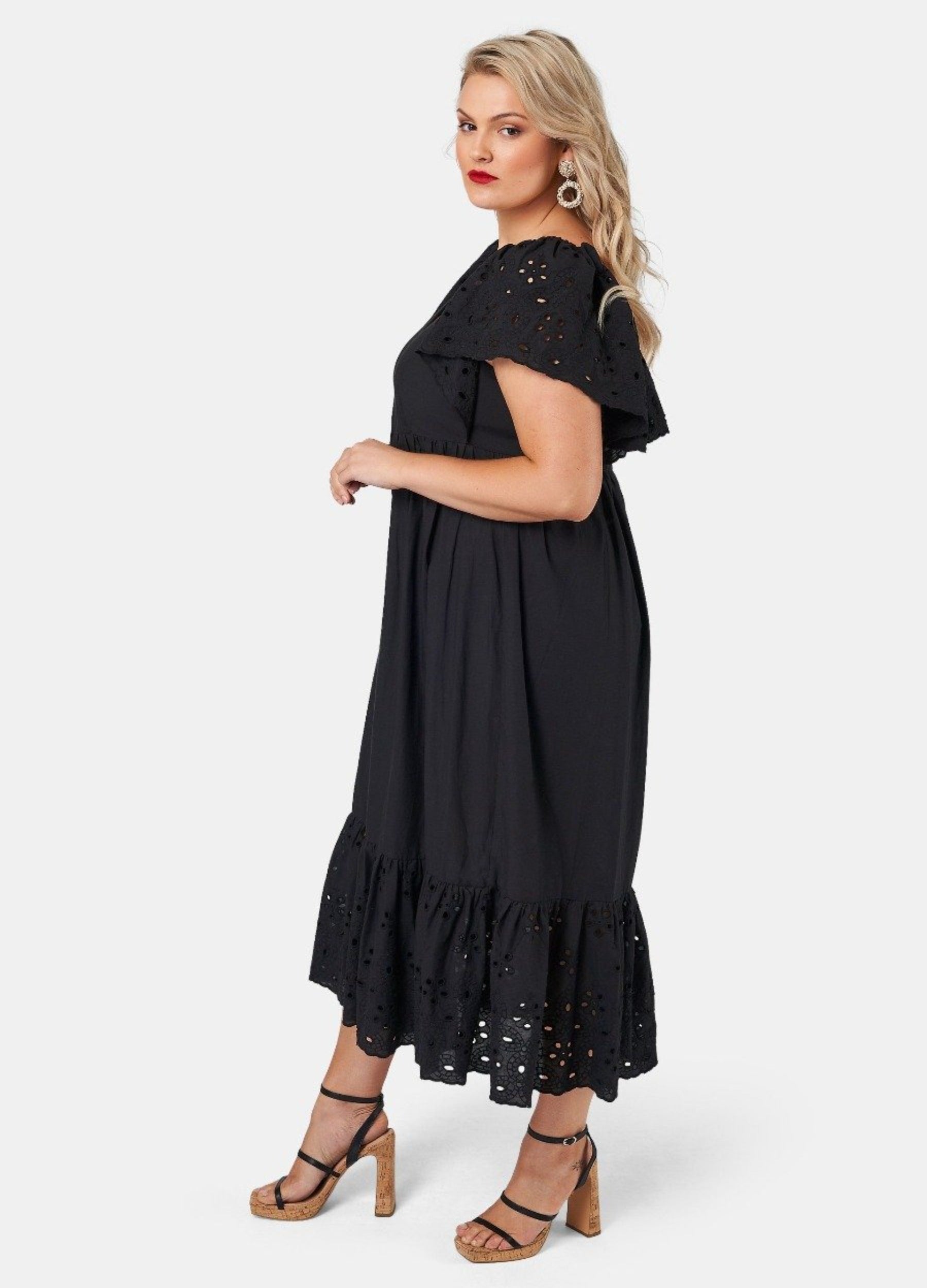 Blonde model wearing black cotton midi dress