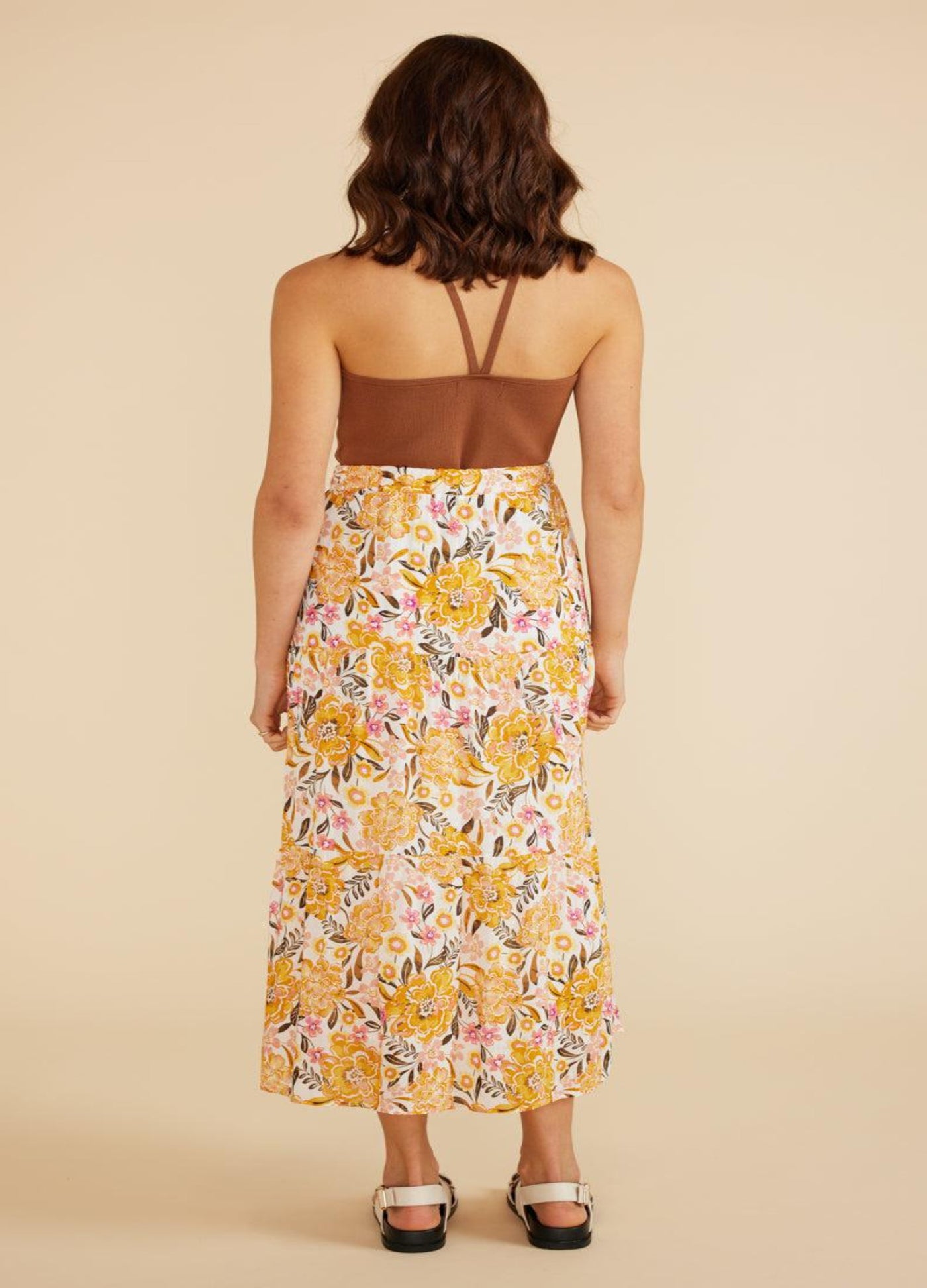Model wearing yellow floral print midi skirt with elasticated waistband from Australian Brand Mink Pink