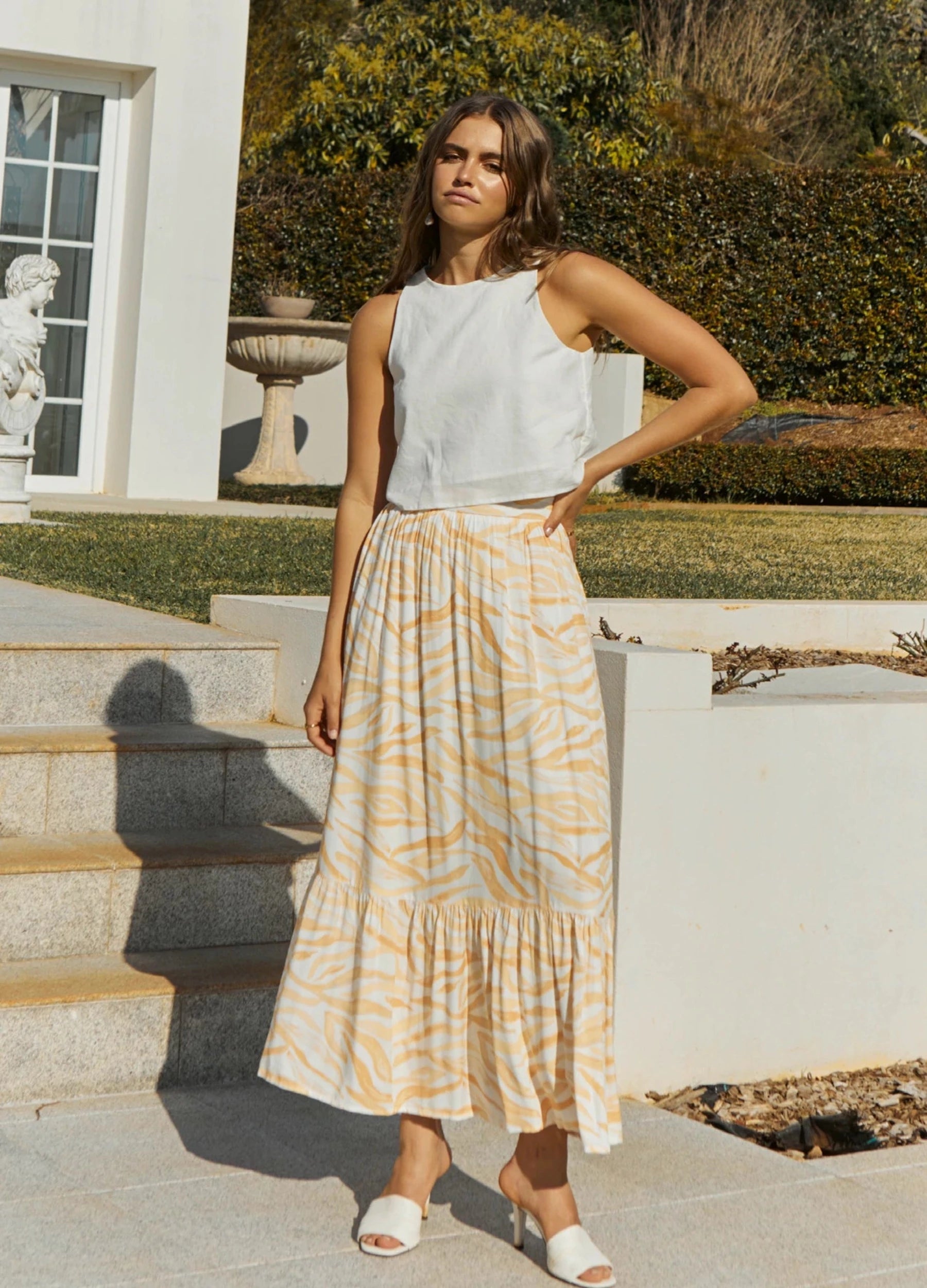 Brunette Model wearing the Finlay Print Maxi Skirt