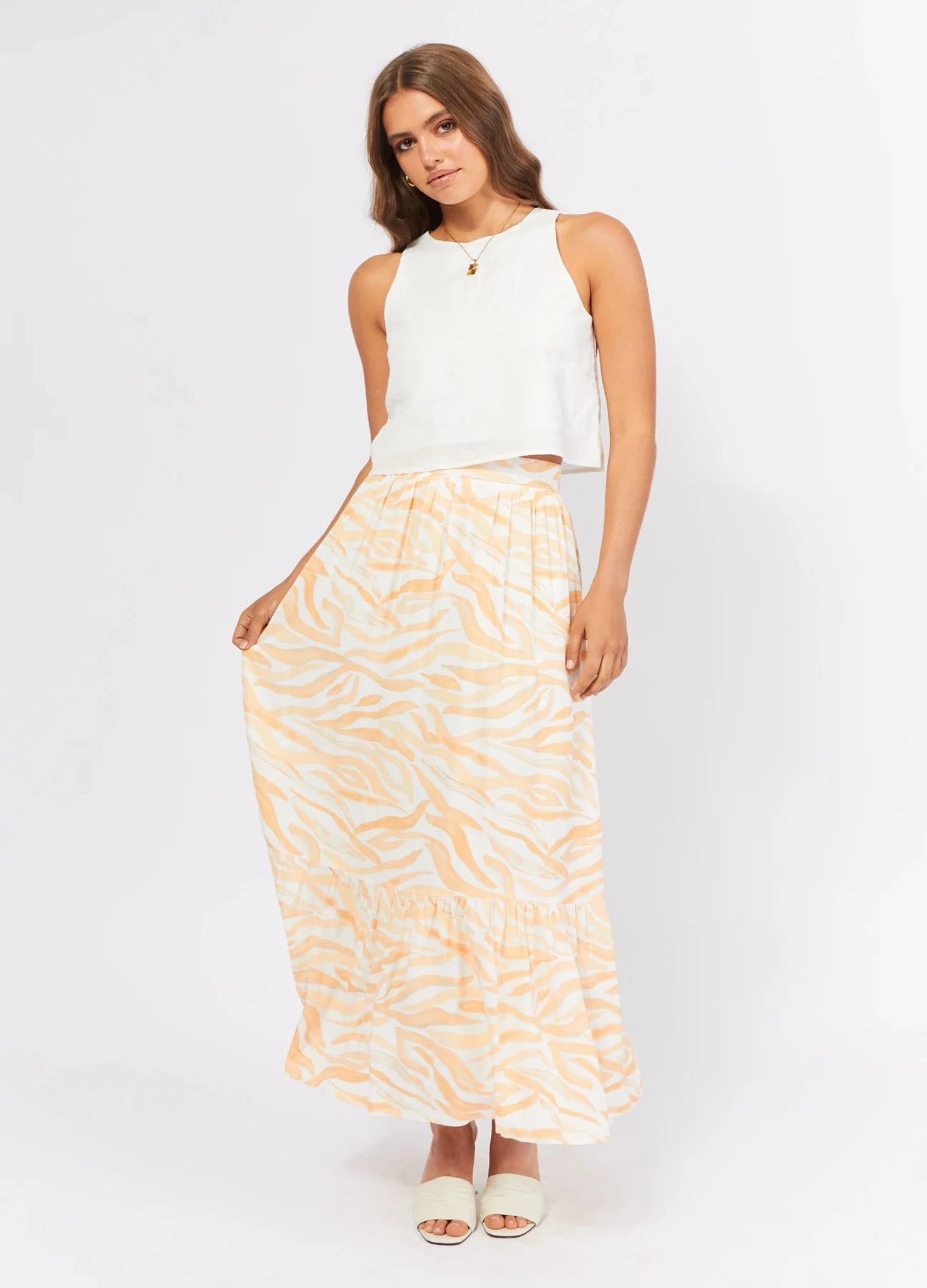 Brunette Model wearing the Finlay Print Maxi Skirt