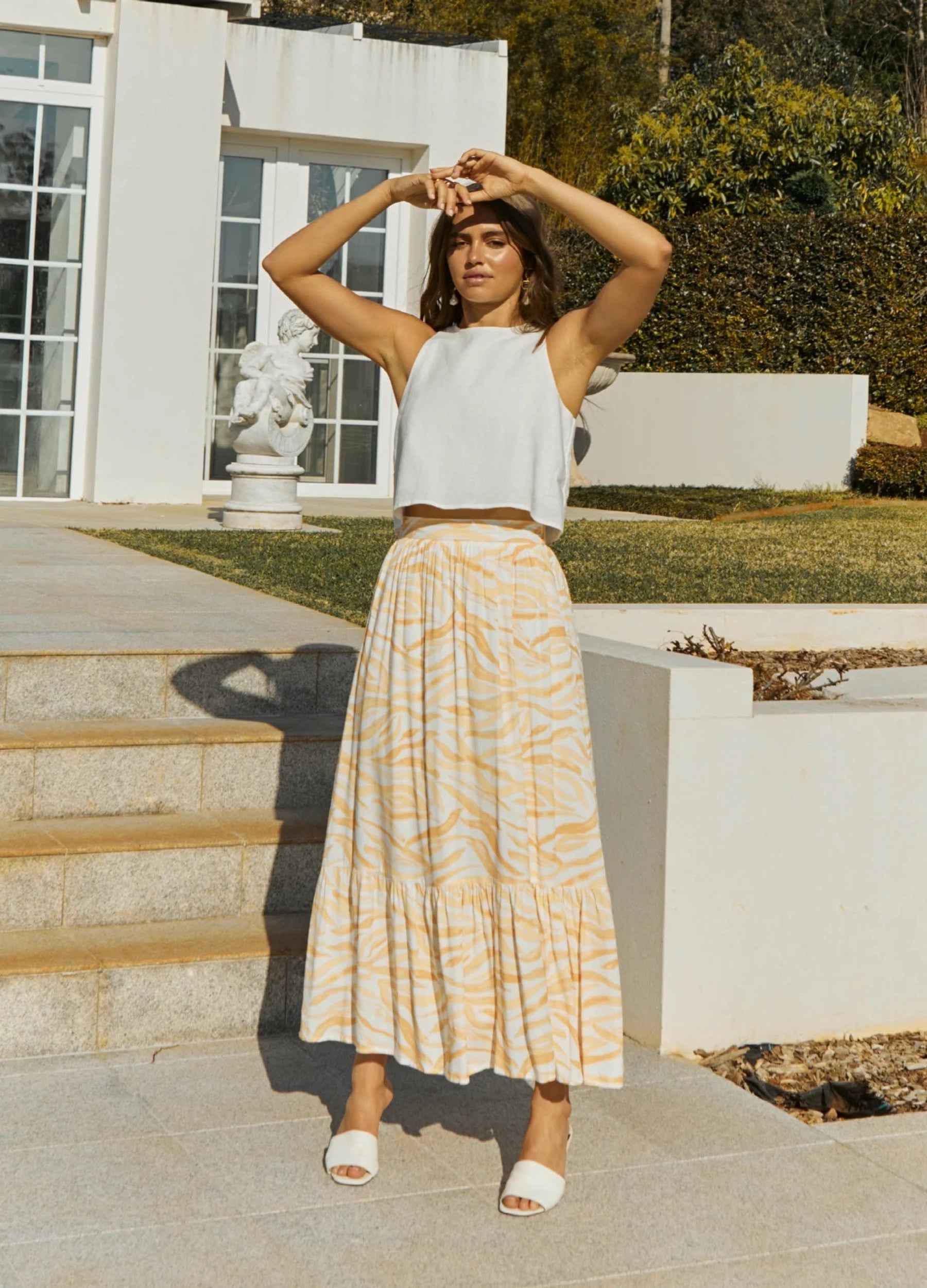 Brunette Model wearing the Finlay Print Maxi Skirt