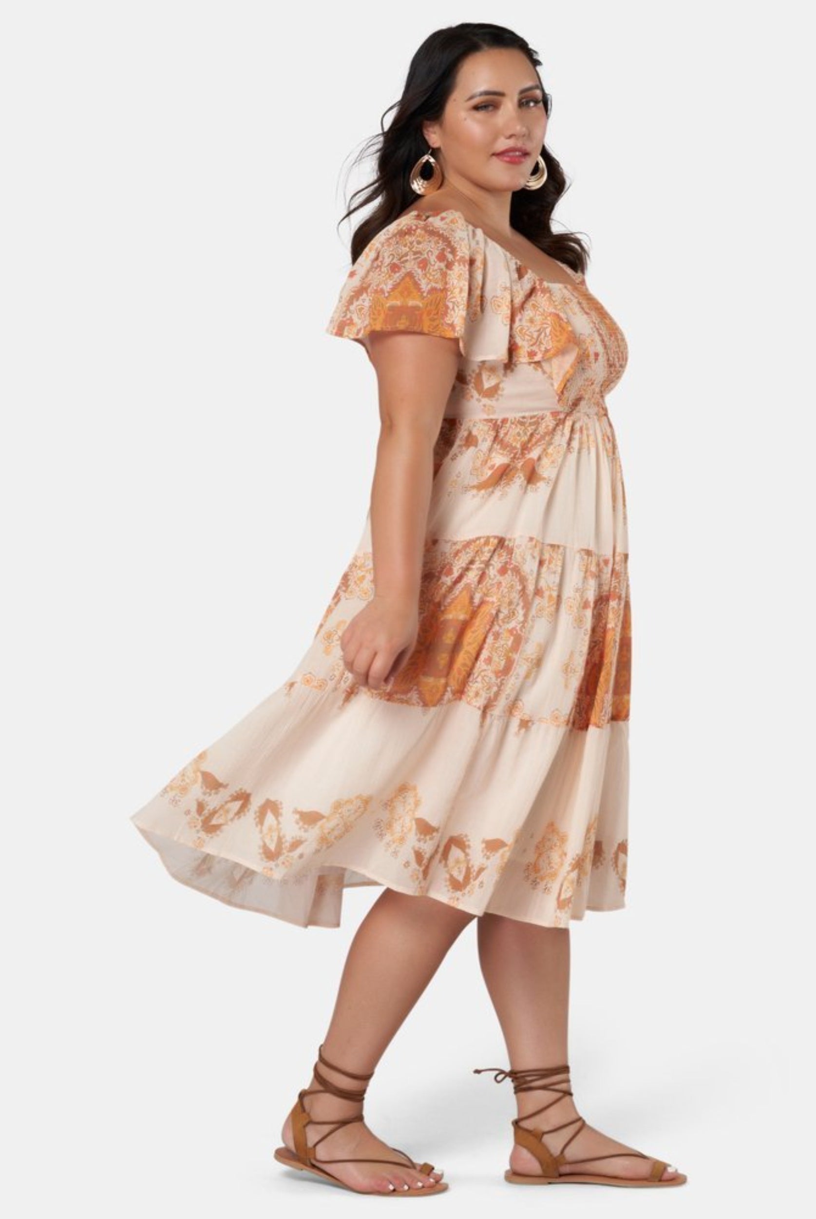 Model wearing orange placement print midi dress