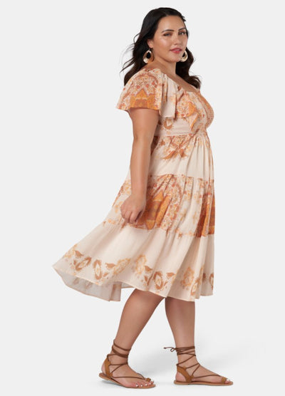 Model wearing orange placement print midi dress