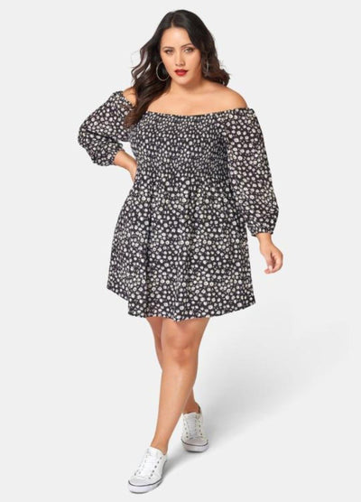 Curvy Woman wearing off shoulder floral print dress with 3/4 sleeve