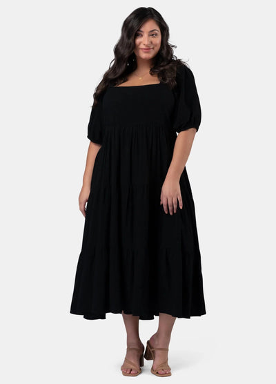 Model wearing the black Isadora Dress