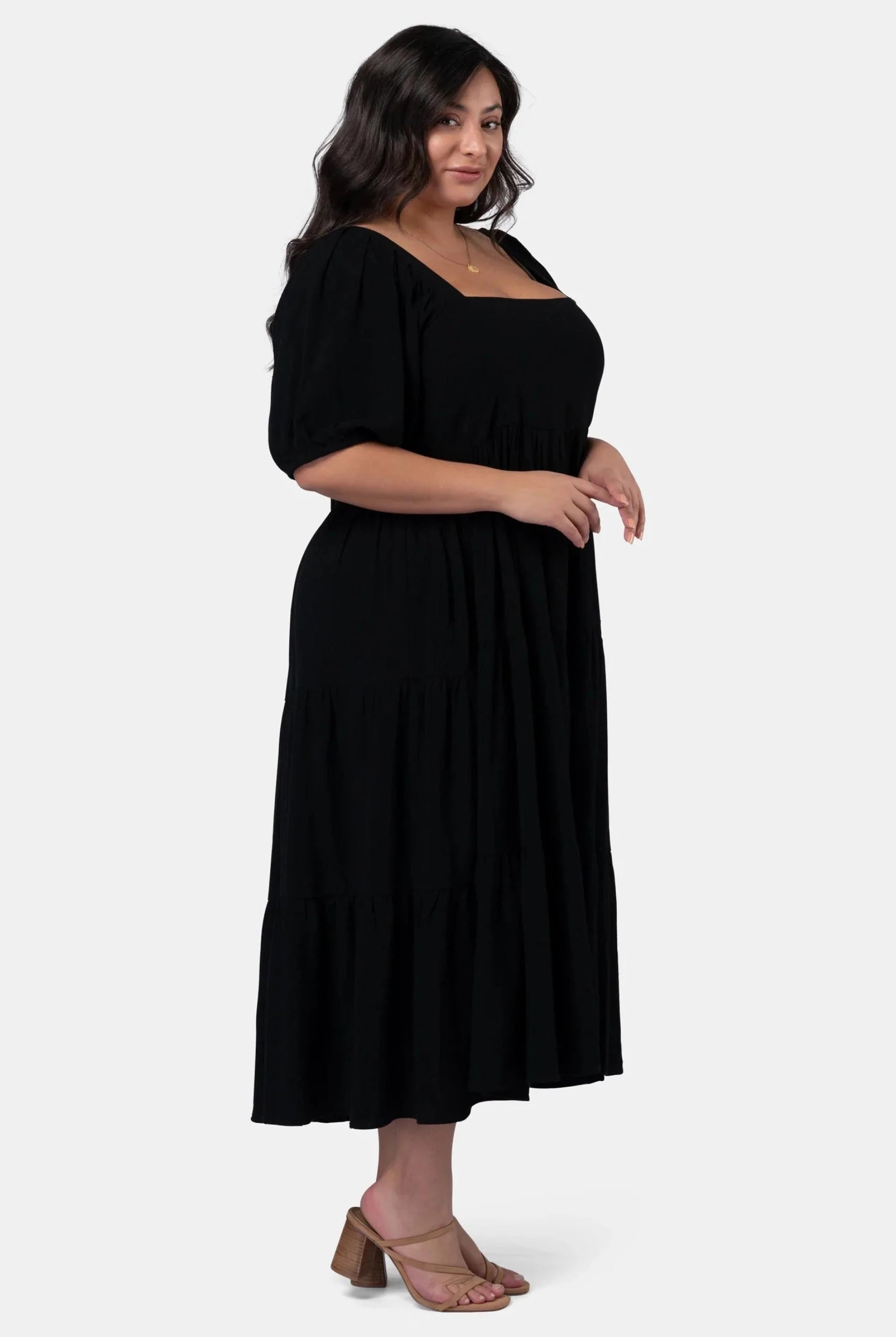 Black isadora dress with puff sleeves and tie at the back