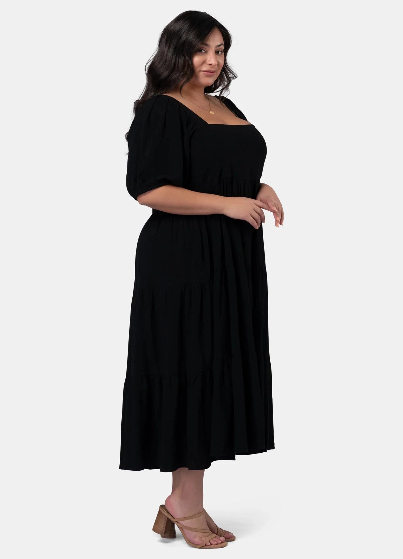 Black isadora dress with puff sleeves and tie at the back