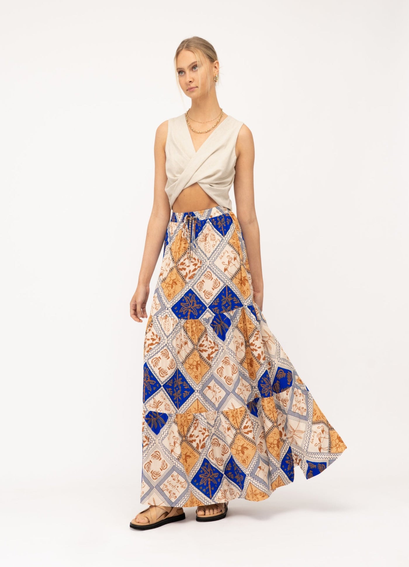 Diamond Print Skirt from Australian Brand Paper Heart. Worn with a neutral top, and gold accessories. 